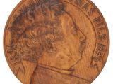 a close up of a coin with a man ' s face on it