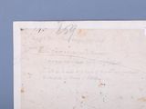 a piece of paper with writing on it sitting on a table