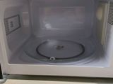 a white microwave oven sitting on a counter in a kitchen