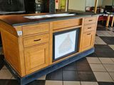 a kitchen island with a sink and a stove in it