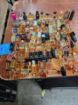 many bottles of alcohol sitting on a table with a price tag