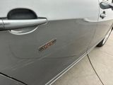 a close up of a car door handle with a sticker on it