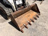 a small bulldozer that is sitting in the dirt