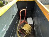 a hose in the back of a truck with a hose attached to it