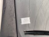 a sticker on the windshield of a car with a sticker attached to it