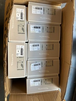 boxes of electronic devices are stacked on top of each other in a cardboard box