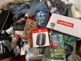 a pile of items that include a nintendo wii, a nintendo wii game controller, a nintendo wii game controller, a nintendo wii controller, and other items