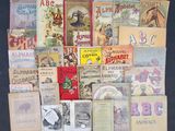 many old children ' s books on display on a table