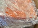 a cardboard box with a bunch of carrots in it
