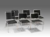 four chairs with black woven seats on a gray background