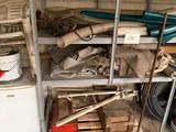 a metal shelf filled with assorted items in a garage