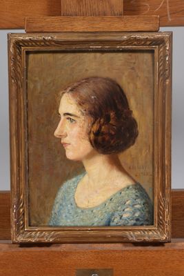 painting of a woman in a blue dress in a wooden frame