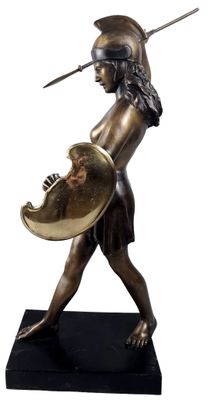 bronze statue of a woman holding a shield and shield