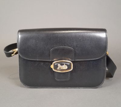 the small black leather bag has a gold buckle on the front