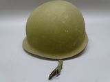 a helmet that is sitting on a white surface