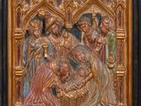 a wooden relief of the nativity of jesus in a church