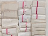 a pile of bags with red and white stripes on them