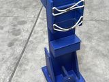 a blue bucket that is sitting on top of a blue stand