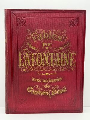 un livre rouge avec des lettres dorées sur la couverture