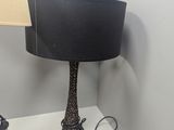 a lamp that is sitting on a table with a lamp on top of it