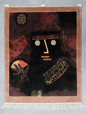 a picture of a painting of a face on a wall