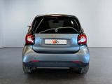 a small car that is parked in a room
