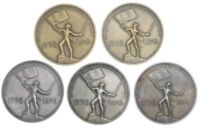 four different types of coins with a man holding a flag