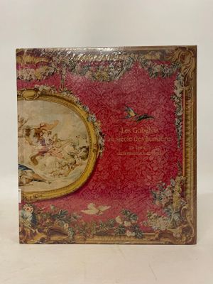 an old book with a picture of a woman and a bird on it
