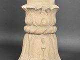 a stone statue of a man with a top hat on