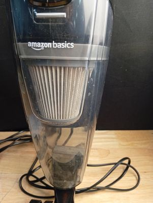 a vacuum that is sitting on a wooden table