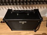 an electric guitar amplifier sitting on top of a hard wood floor