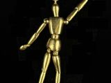 an image of a gold figurine on a black background