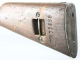 a close up of a rifle on a white surface with a white background