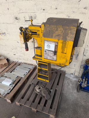 a machine that is sitting on a pallet in a warehouse