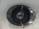 a metal bowl with a piece of metal sticking out of it