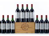 six bottles of red wine in a wooden crate on a white background