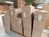 a lot of cardboard boxes stacked on top of each other in a warehouse