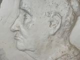 a close up of a sculpture of a man ' s face