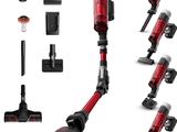 un gros plan sur un aspirateur rouge et d'autres accessoires