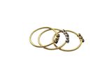 a stack of three gold rings with diamonds on them
