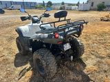 an image of a four wheeler atv parked in a field