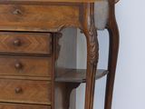 a wooden desk with a mirror on top of it