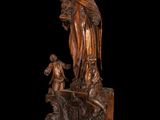 an image of a statue of a woman holding a child