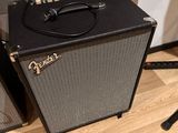 two amps sitting on the floor next to each other