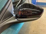 a sticker on the side view mirror of a car