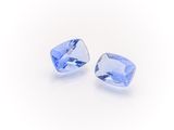 a pair of blue sapphires on a white background
