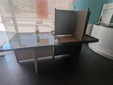 a glass table with a bottle of water on top of it