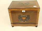a small wooden box with a decorative design on it