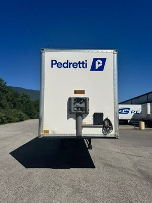 a white box truck with a pay meter on the back of it