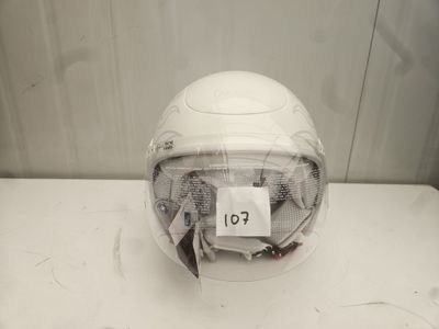 a white helmet with a tag on it sitting on a table